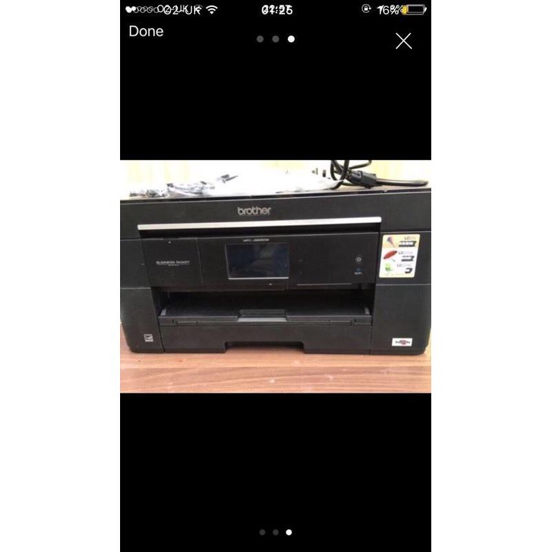 Brother MCF-J625DW A3 printer, with ink cartridges, connectors and more.