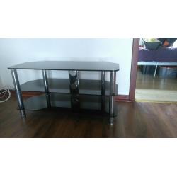 black glass and chrome tv stand