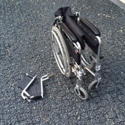 Enigma self propel wheelchair with right leg elevating foot rest
