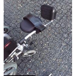 Enigma self propel wheelchair with right leg elevating foot rest