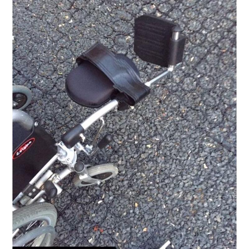 Enigma self propel wheelchair with right leg elevating foot rest