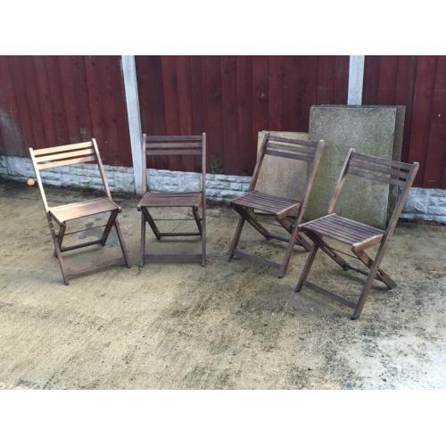 Four wooden garden chairs