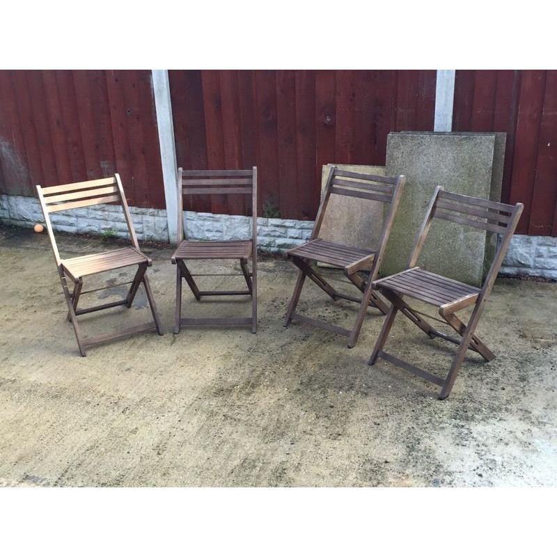 Four wooden garden chairs