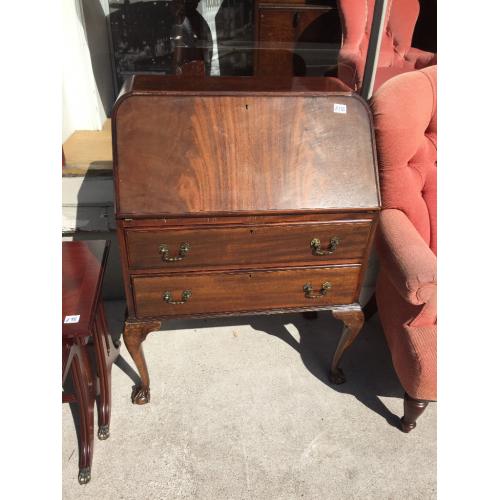 Vintage Bureau , with ball and claw feet , leather insert .