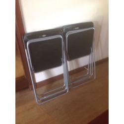 4 black & silver folding chairs.