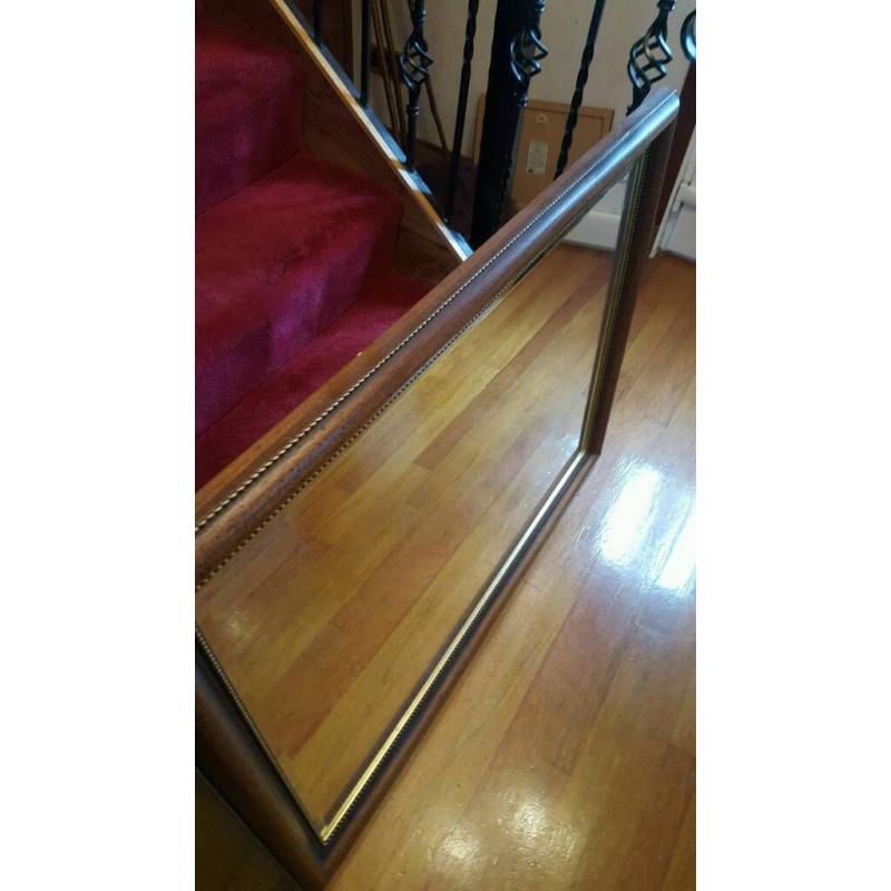 Dark wooden decorative mirror
