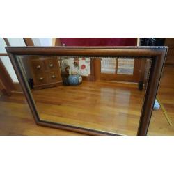 Dark wooden decorative mirror