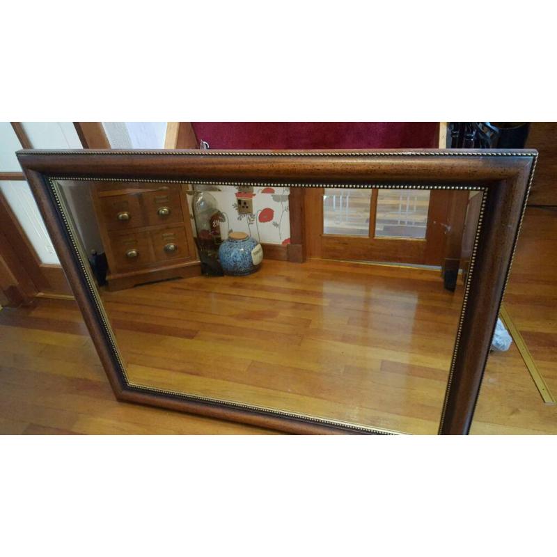 Dark wooden decorative mirror