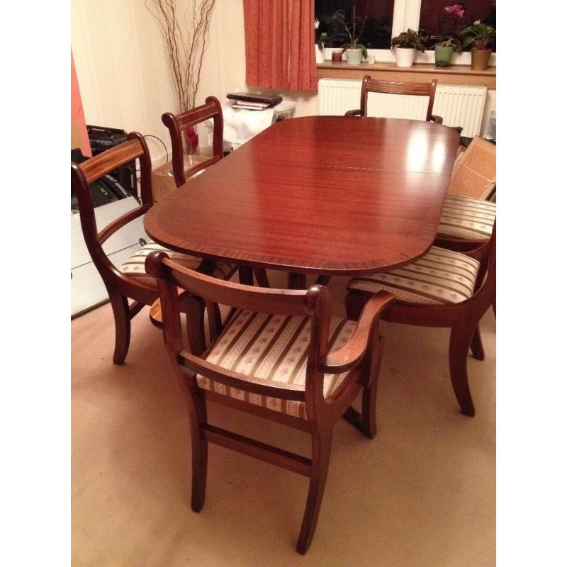 Extentable table and set of 6 excellent quality matching chairs, table sits upto 10 people