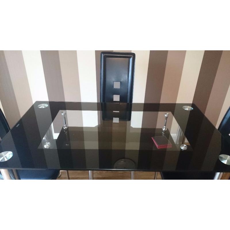 Black glass top dining table and 4 chairs