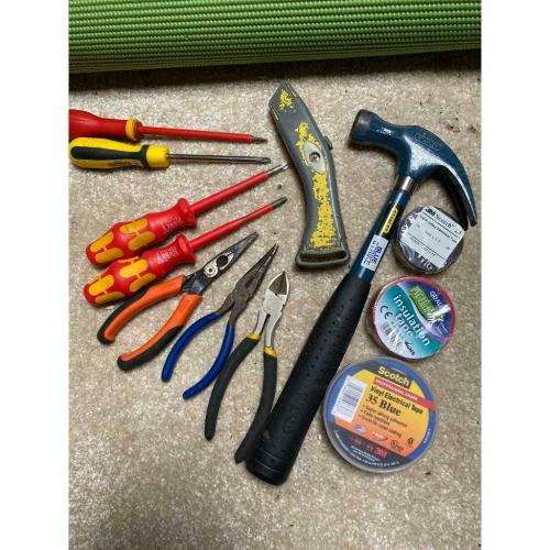 Random Selection of Tools and Electrical Tape Hammer Screwdriver Pliers Stanley Knife