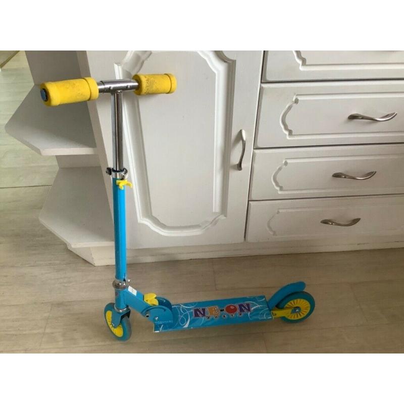 Neon Racer two wheel scooter. Foldable and adjustable height.