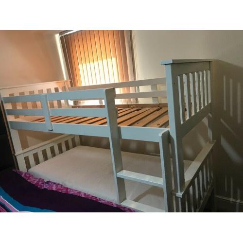 Kids bunk bed without mattress. Dismantle & ready to pick up.