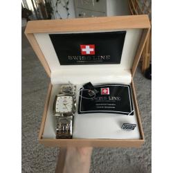 Beautiful Swiss line men?s watch; nice gift for Christmas!! Protective wrap still on watch!