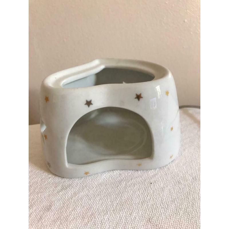 Tea light candle holder with cut out stars