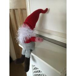 A HAND KNITTED CHRISTMAS GNOME