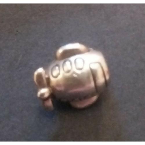 Adorable little plane charm.