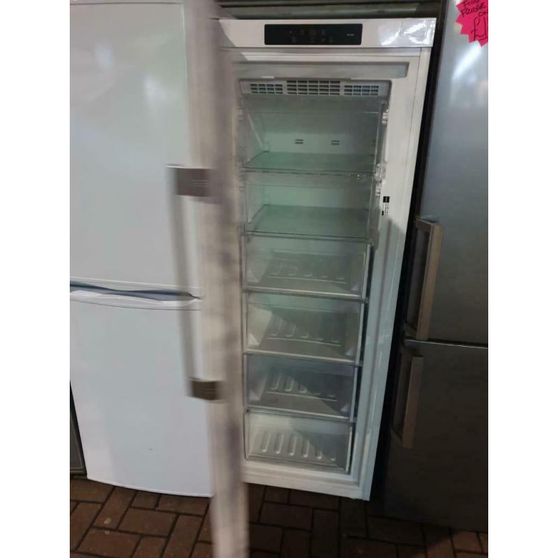 White upright Hotpoint freezer