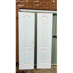 Pair of white interior double doors. OFFERS INVITED TO CLEAR.