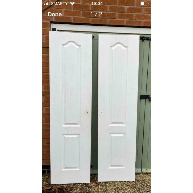 Pair of white interior double doors. OFFERS INVITED TO CLEAR.