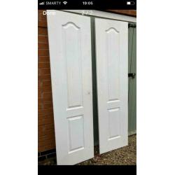 Pair of white interior double doors. OFFERS INVITED TO CLEAR.