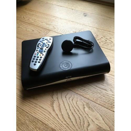 Sky satellite box with remote control and power cable