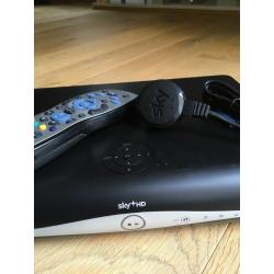 Sky satellite box with remote control and power cable