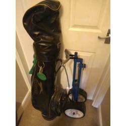 Set of golf clubs, bag and trolley.