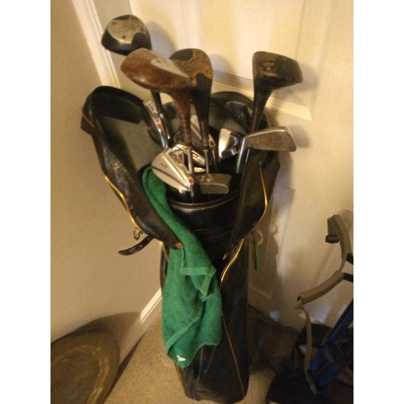 Set of golf clubs, bag and trolley.