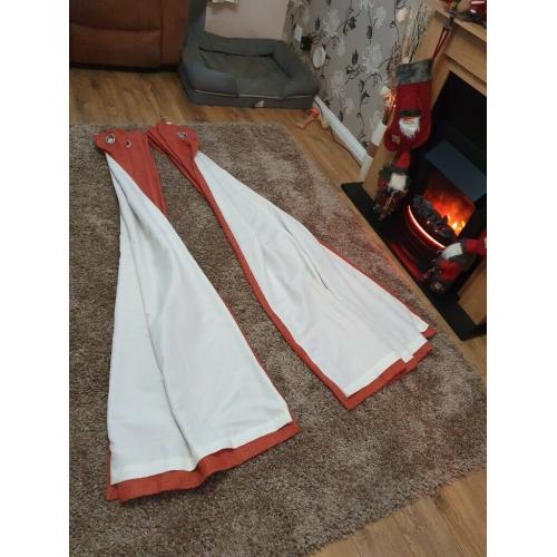 Burnt orange lined eyelet curtains