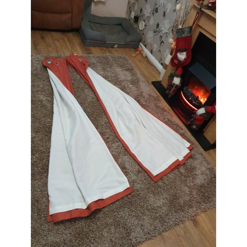 Burnt orange lined eyelet curtains