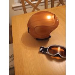 Child's snow helmet and goggles