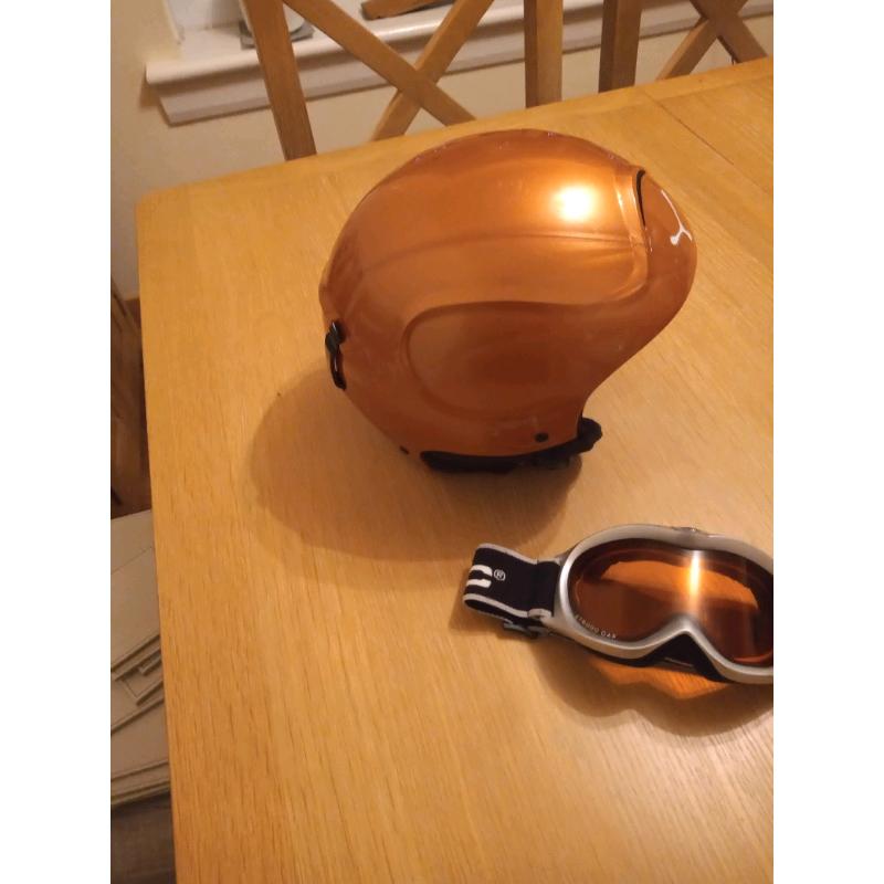 Child's snow helmet and goggles
