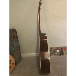 Acoustic guitar, solid spruce top.