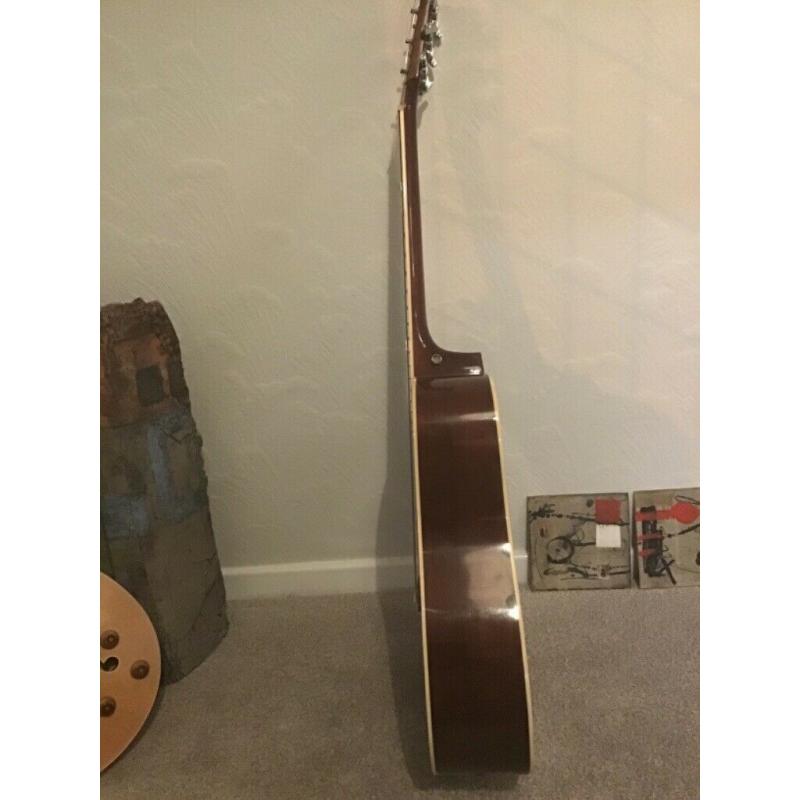 Acoustic guitar, solid spruce top.