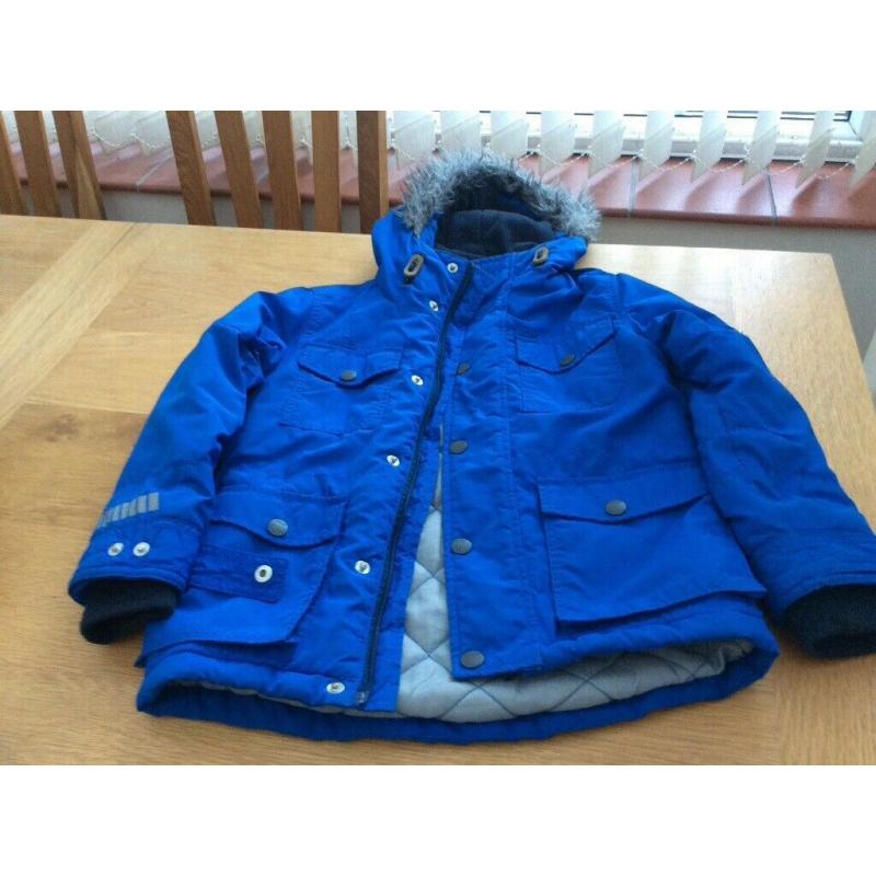 Child?s blue Next anorak age 7